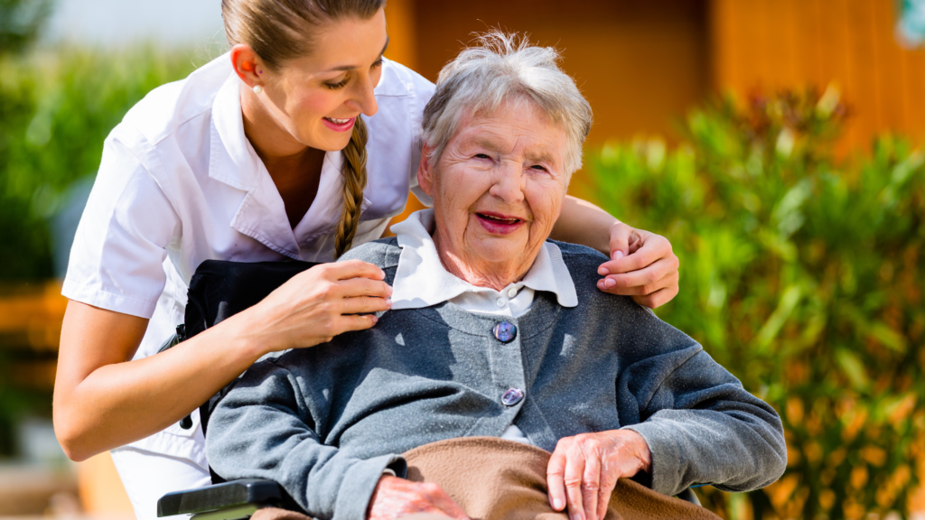 happy nursing home resident tended to by a nurse