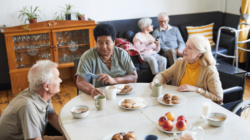 nursing home residents sharing a meal
