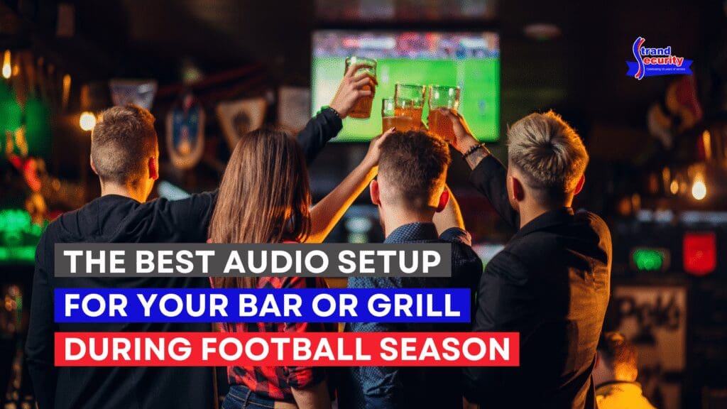 Football fans cheering on a play on the TVs in a sports bar with a commercial audio system