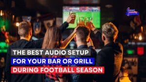 Football fans cheering on a play on the TVs in a sports bar with a commercial audio system